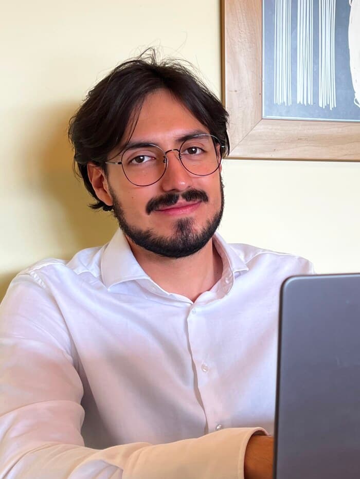 Photo of Nico Ceron working at a laptop